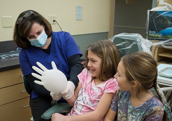Dental Hygienist with a pediatric dental patient in Swanton OH